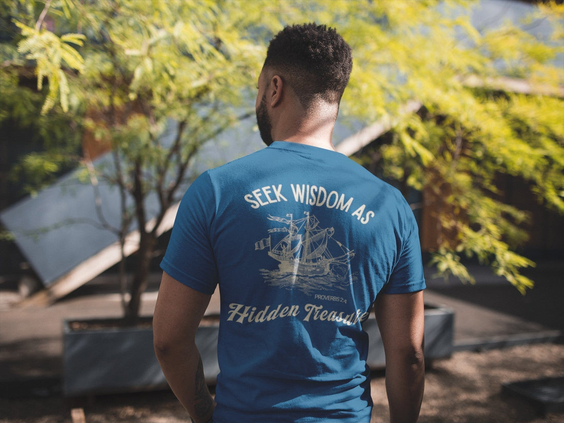 Young man wearing Christian graphic tee inspired by Proverbs 2:4