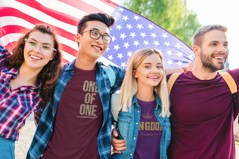 A group of friends wearing christian graphic shirts. 
