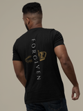 A man shown from the back wearing a black Christian identity t-shirt with a graphic design on the back. The design features the word 'FORGIVEN' printed vertically in white, alongside a gold crown and a gold circular emblem.