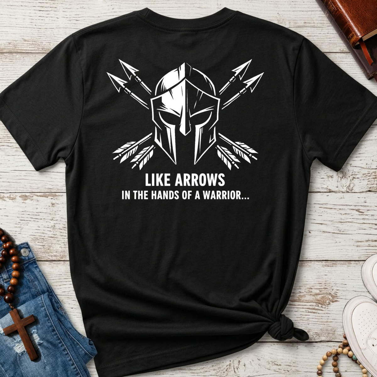 Black shirt with a warrior sketch in white with arrows behind the helmet and the words "like arrows in the hands of a warrior..."