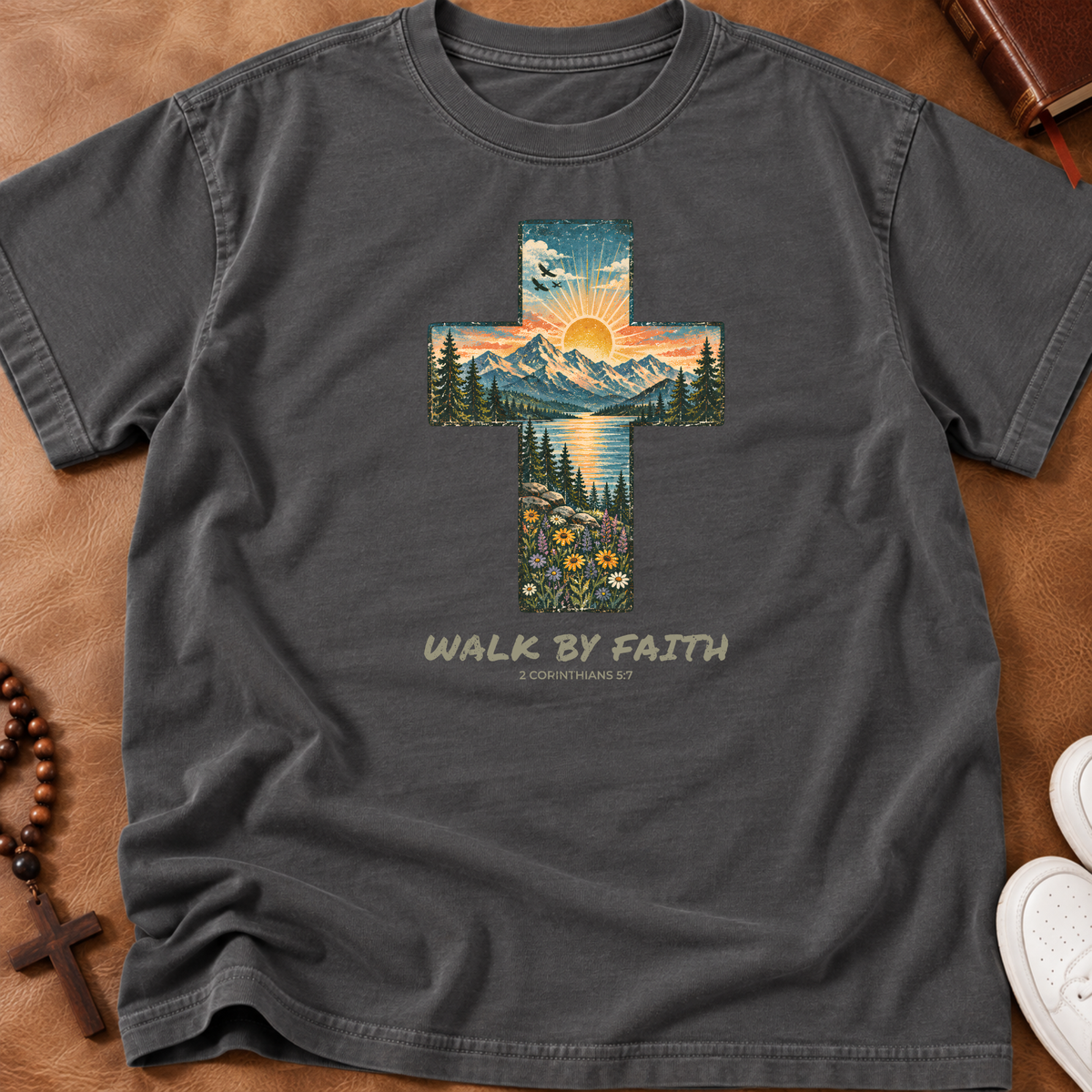 Comfort Colors pepper shirt that has a cross with a sunset landscape inlaid and the words 'walk by faith' and '2 corinthians 3:7'