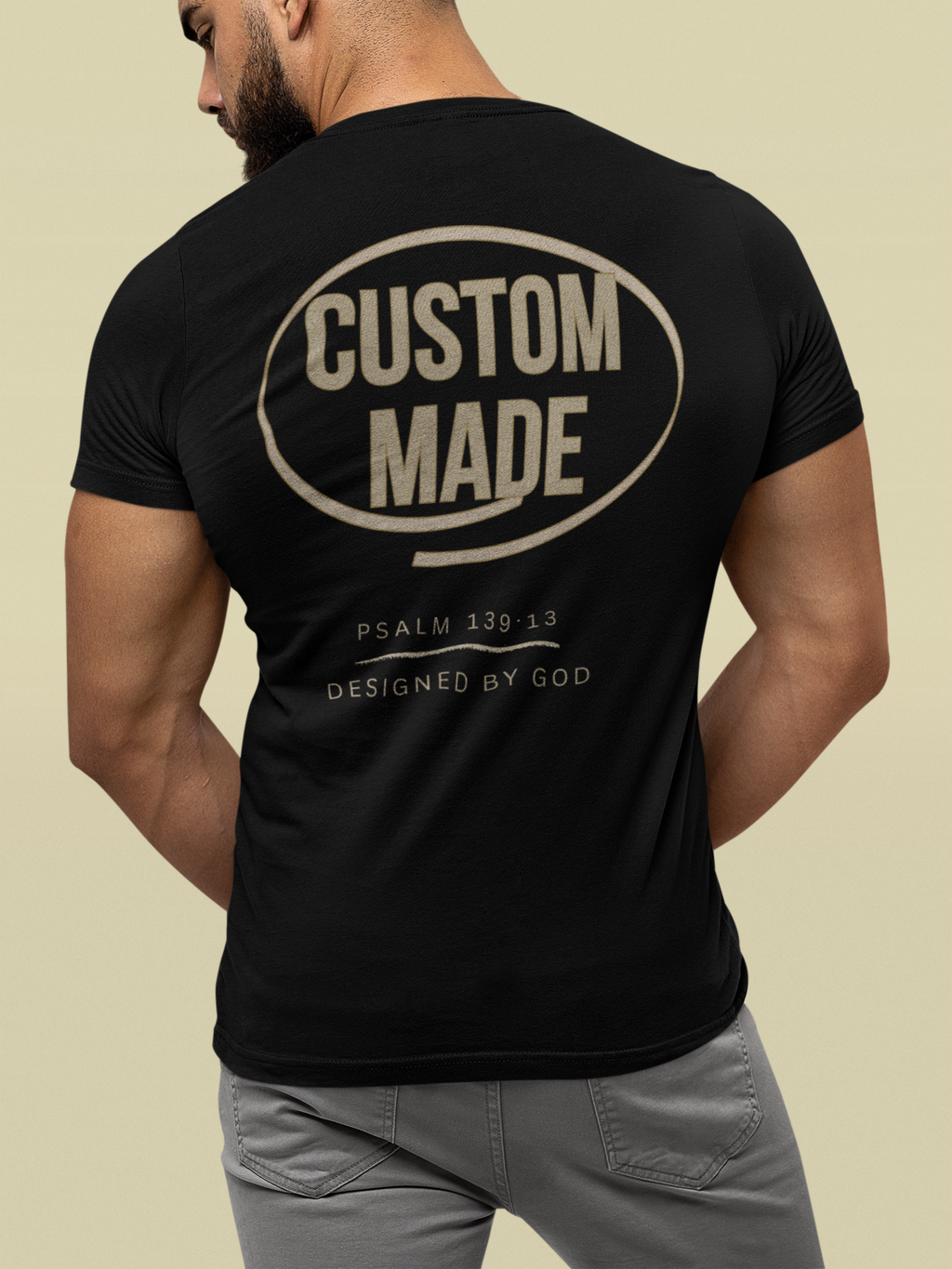 Backview of a Christian graphic shirt with the word Custom Made centered on the back and Psalm 139:13 below in smaller letters with the phrase "designed by God" following below the verse.