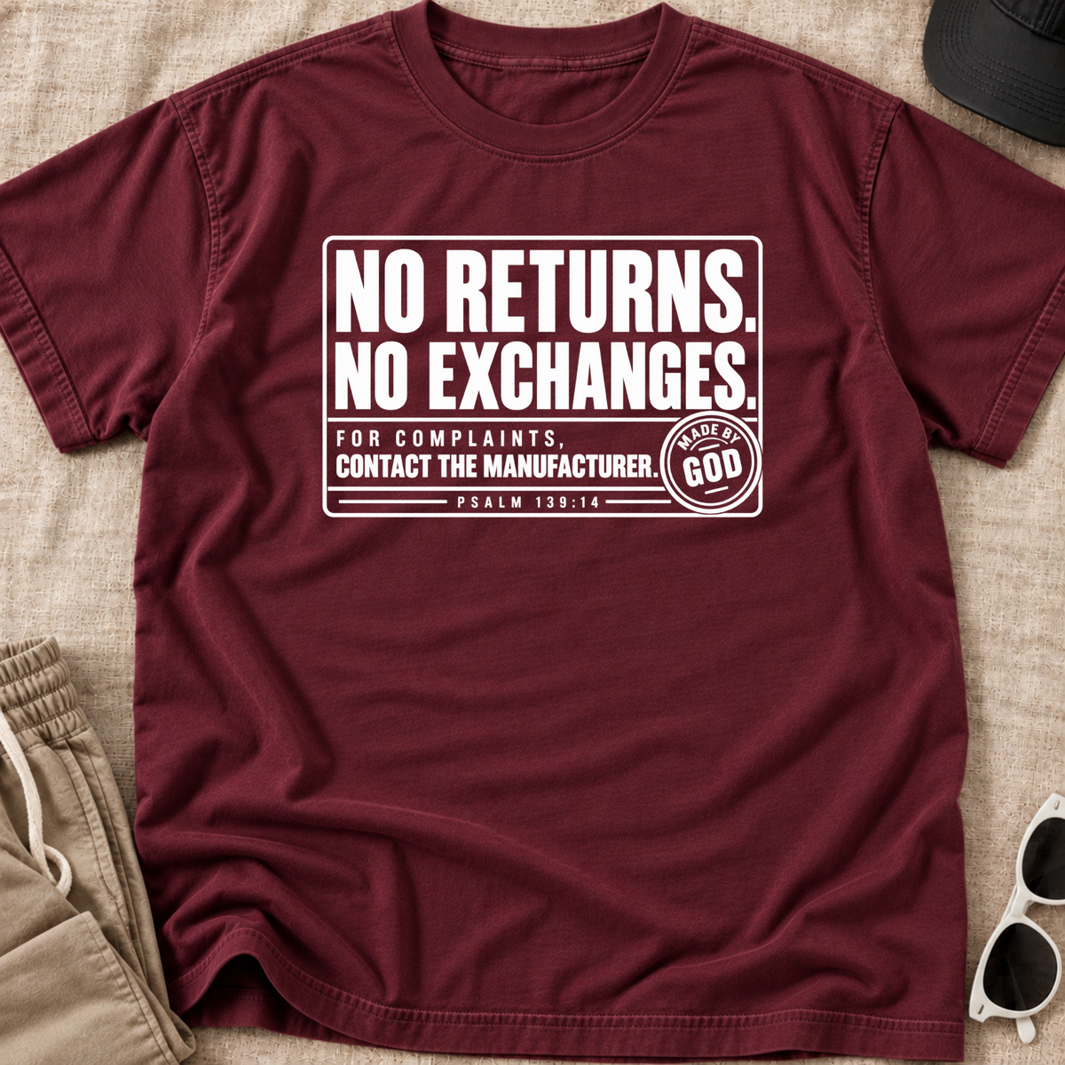 maroon christian youth shirt by SeedSowerGraphics laid out with white text that says "no returns. no exchanges. for complaints, contact the manufacturer' made by god' beneath it says psalm 139:14